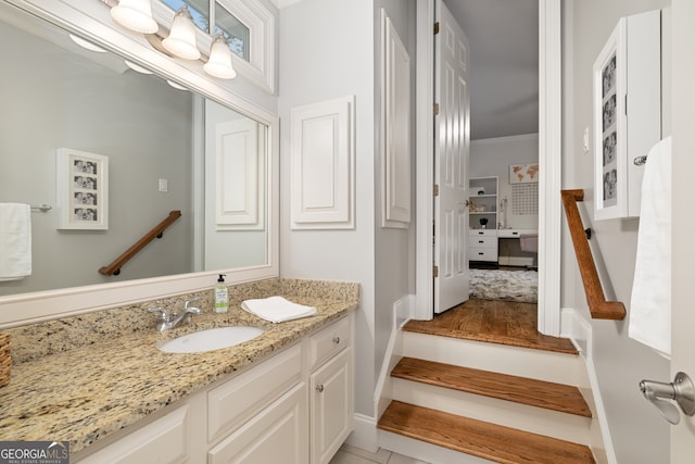 bathroom with vanity, tile patterned floors, and ornamental molding