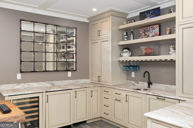 kitchen featuring wine cooler, cream cabinets, dark hardwood / wood-style flooring, sink, and light stone counters