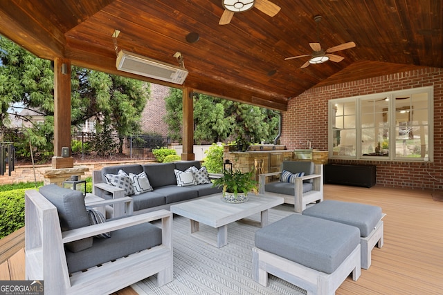 deck featuring an outdoor living space and ceiling fan