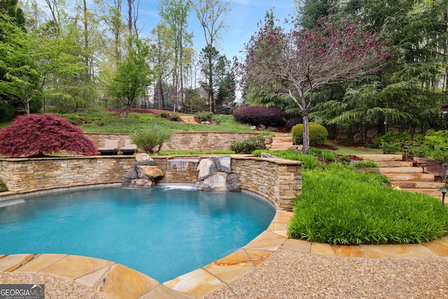 view of pool featuring pool water feature