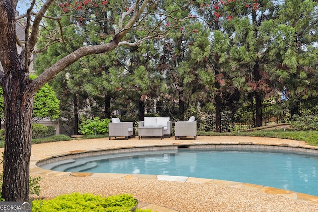 view of pool featuring a patio area