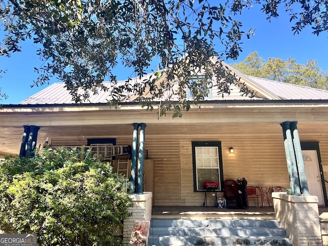 rear view of house with a porch