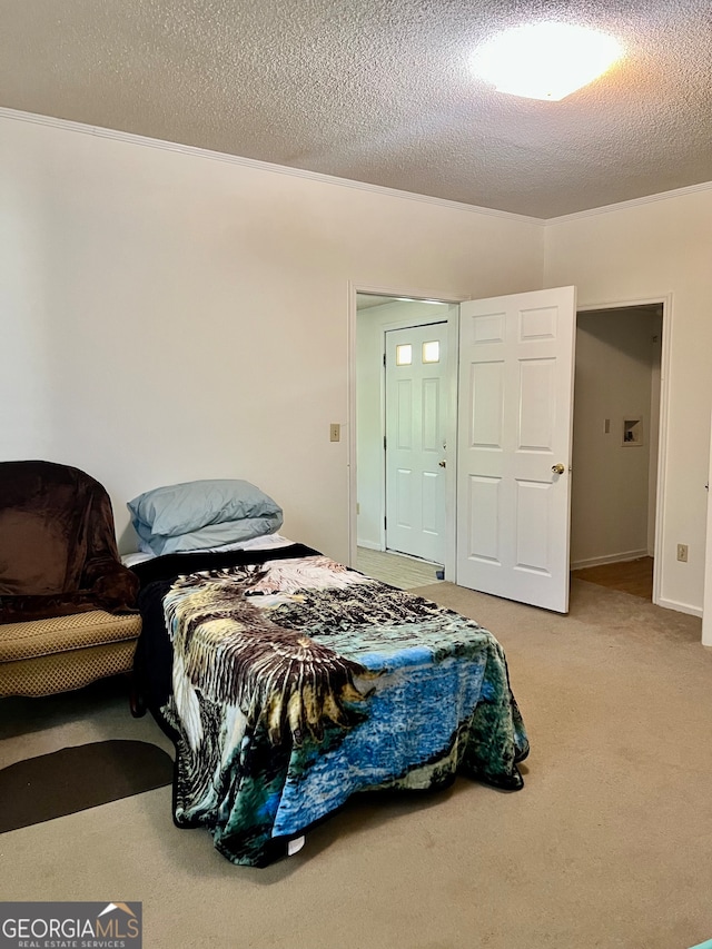 carpeted bedroom featuring a textured ceiling