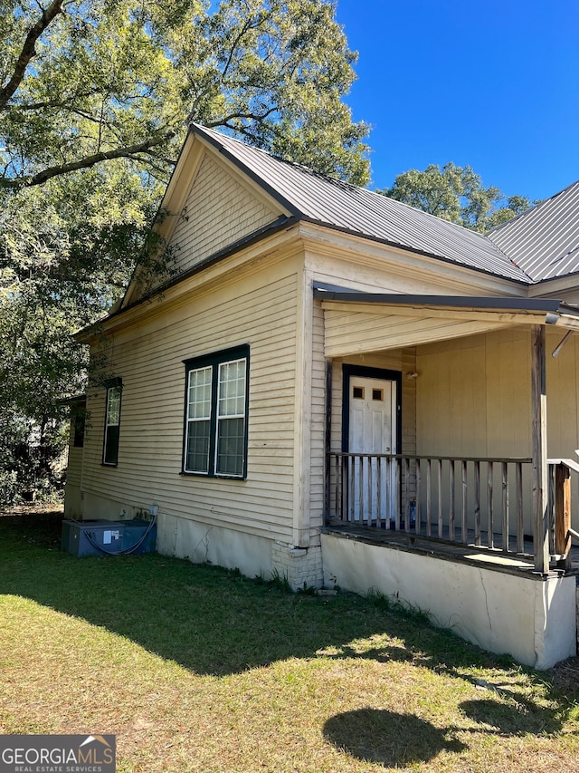 view of home's exterior with a lawn