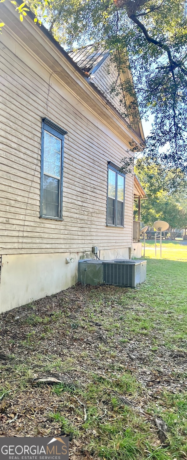 view of home's exterior featuring a yard