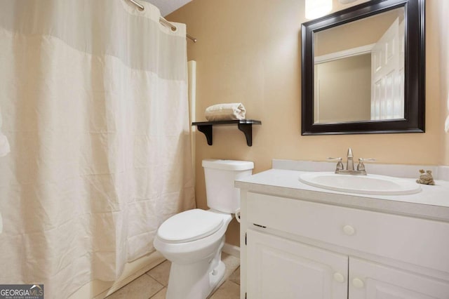 bathroom with vanity, a shower with curtain, toilet, and tile patterned floors