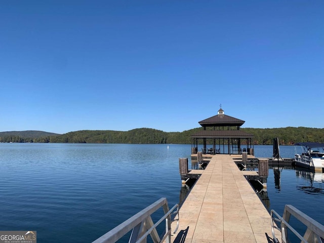 dock area featuring a gazebo and a water view