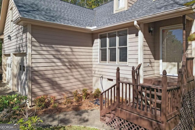 property entrance featuring a wooden deck