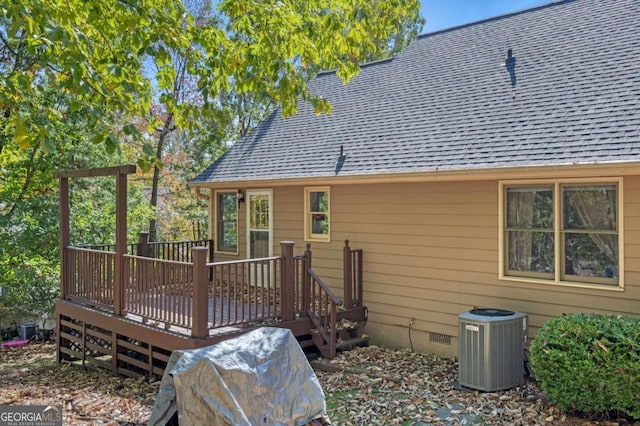 back of house featuring central air condition unit and a deck