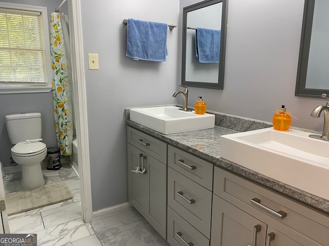 full bathroom featuring toilet, shower / tub combo, and vanity