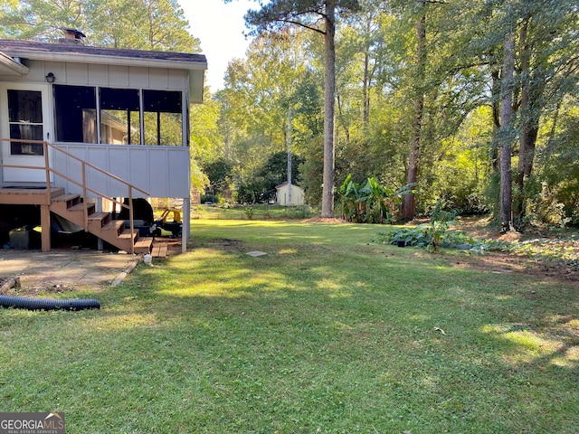 view of yard with a sunroom