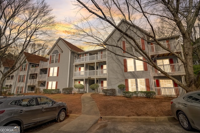 view of outdoor building at dusk