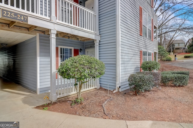 view of side of home with a balcony