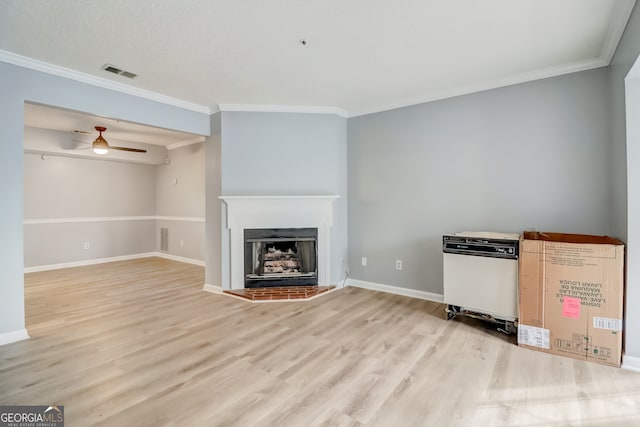 unfurnished living room featuring light hardwood / wood-style floors, ornamental molding, and ceiling fan