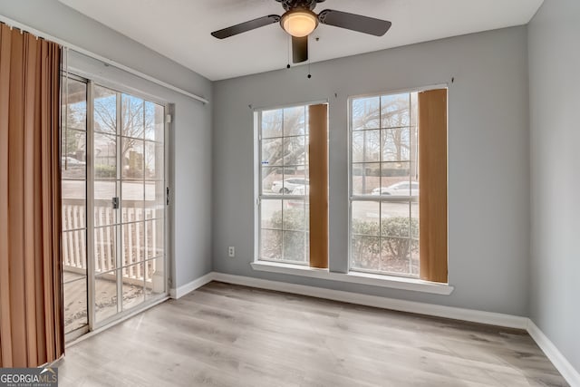 unfurnished dining area with light hardwood / wood-style flooring, a wealth of natural light, and ceiling fan