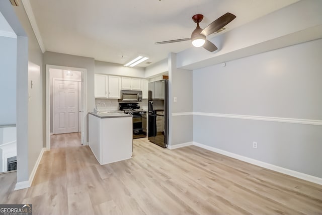 kitchen featuring black appliances, ceiling fan, white cabinets, decorative backsplash, and light hardwood / wood-style flooring