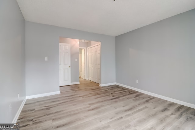 unfurnished room featuring light wood-type flooring