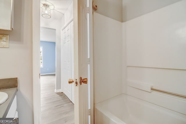 bathroom featuring vanity and hardwood / wood-style flooring