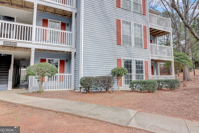 view of side of home featuring a balcony