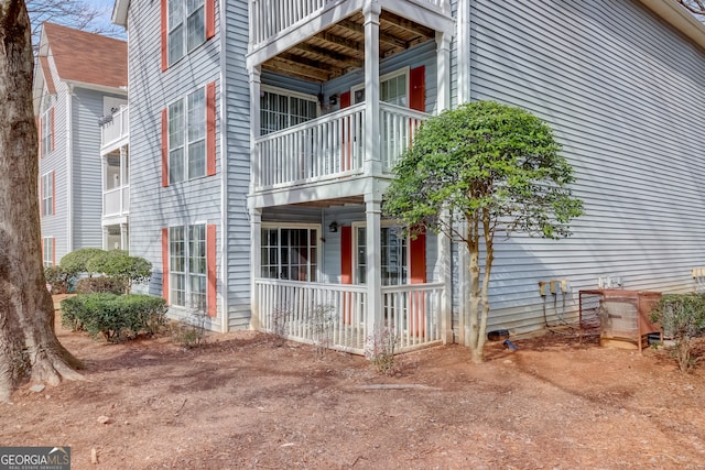 view of side of property with a balcony