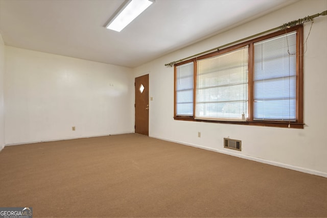 unfurnished room with carpet flooring