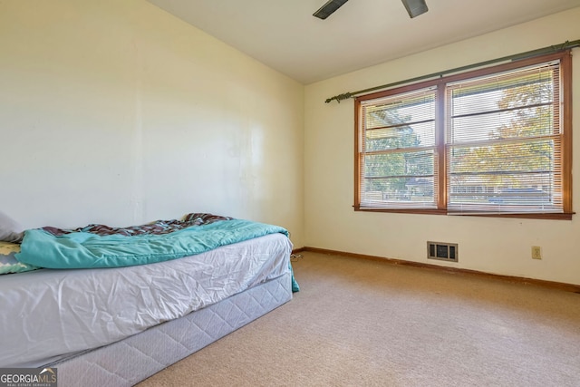 bedroom with ceiling fan and carpet floors