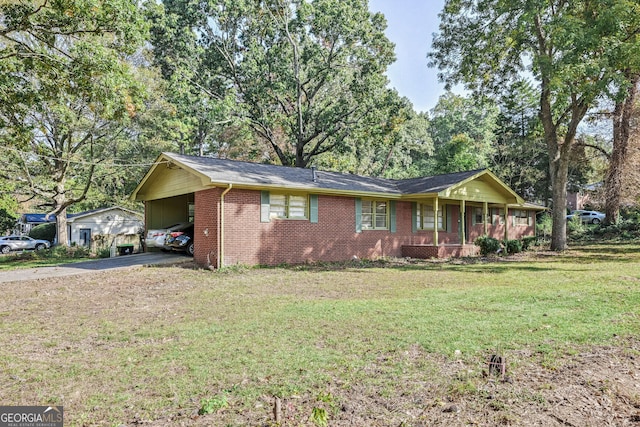 ranch-style house with a front lawn and a carport