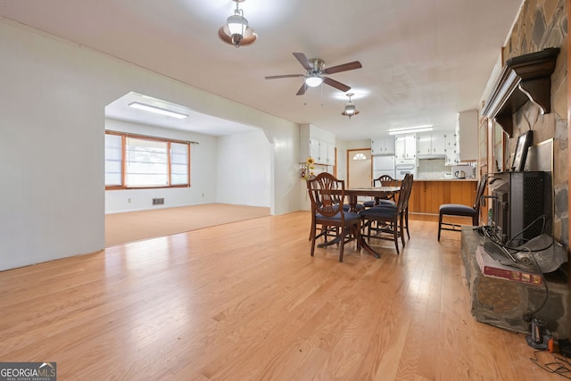 dining space featuring ceiling fan and light hardwood / wood-style flooring