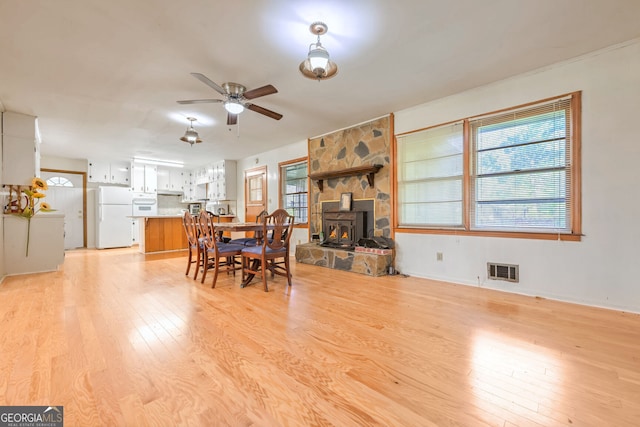 dining area featuring light hardwood / wood-style flooring and ceiling fan