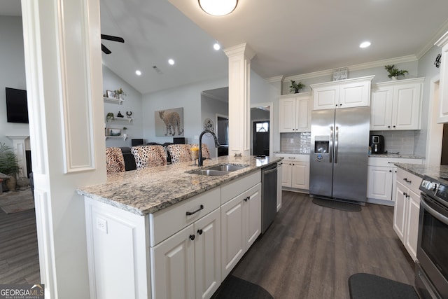 kitchen with white cabinets, appliances with stainless steel finishes, dark wood-type flooring, and sink