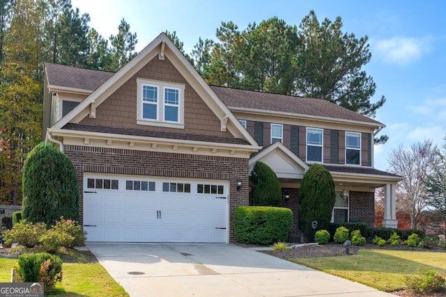 craftsman-style home featuring a garage and a front yard