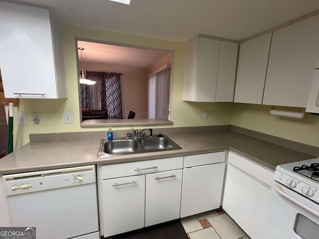 kitchen featuring sink, white cabinetry, and white appliances