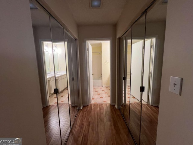 hallway featuring hardwood / wood-style floors