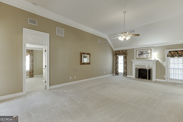 unfurnished living room with light colored carpet, lofted ceiling, ceiling fan, and crown molding