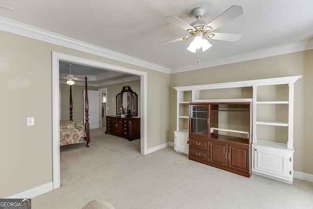 bedroom featuring ceiling fan, baseboards, light colored carpet, and crown molding
