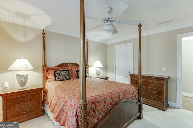 bedroom with visible vents, a ceiling fan, light carpet, ornamental molding, and baseboards