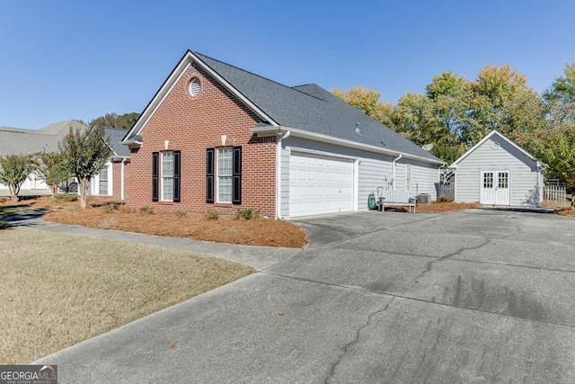 view of front of house featuring an attached garage, brick siding, and concrete driveway