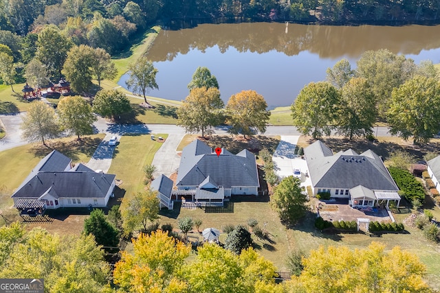 birds eye view of property with a water view