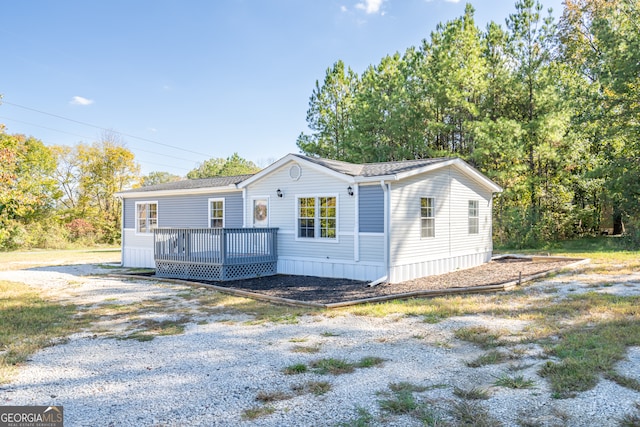 view of front of home featuring a wooden deck