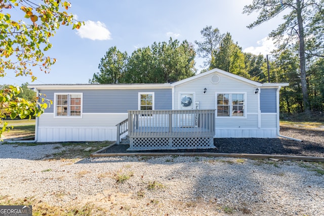 manufactured / mobile home with a wooden deck