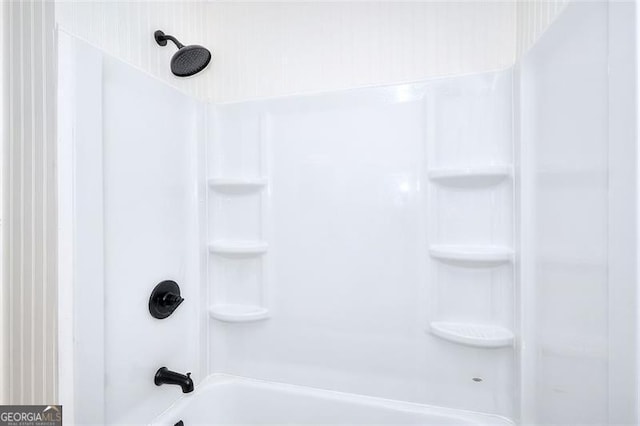 bathroom with shower / washtub combination