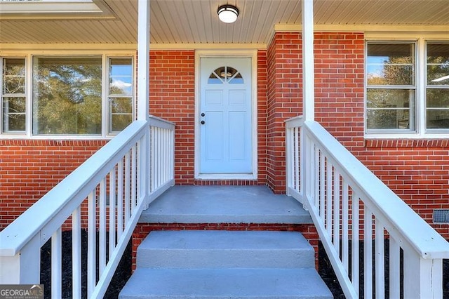 doorway to property with covered porch