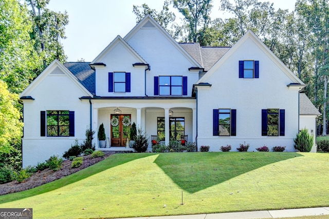 view of front facade featuring a porch and a front lawn