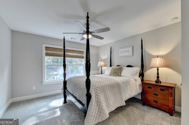 bedroom featuring ceiling fan and light colored carpet