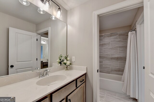 bathroom with vanity and shower / tub combo with curtain