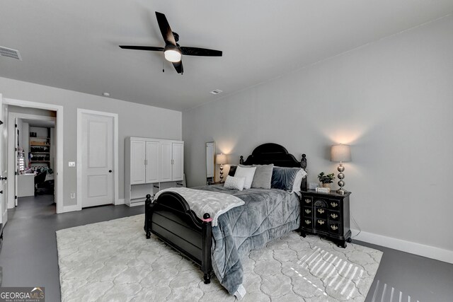 bedroom with concrete flooring and ceiling fan