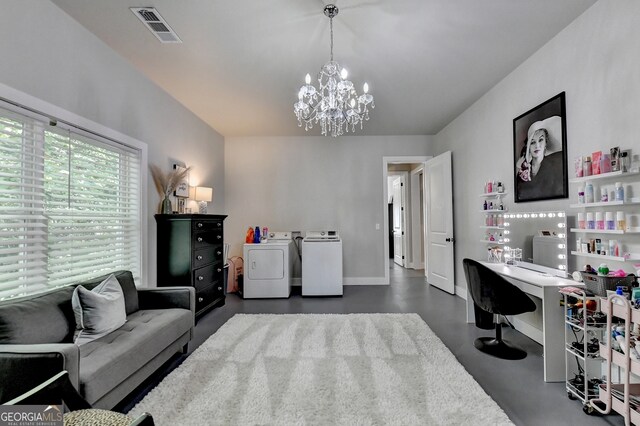 interior space with a notable chandelier and separate washer and dryer