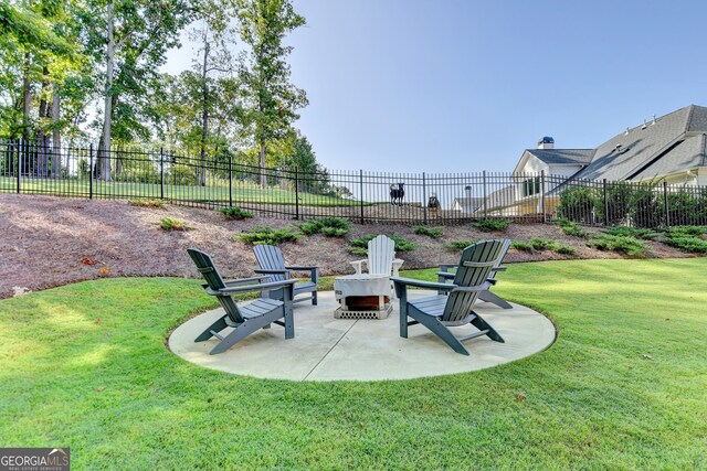 view of yard with a patio and a fire pit