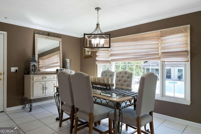 tiled dining room featuring a chandelier and crown molding