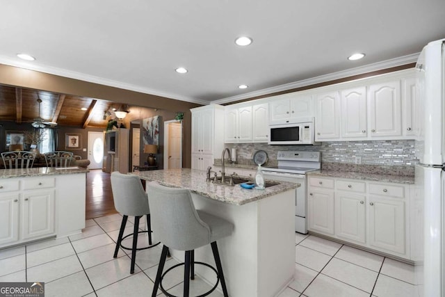 kitchen with white cabinetry, vaulted ceiling with beams, crown molding, sink, and white appliances